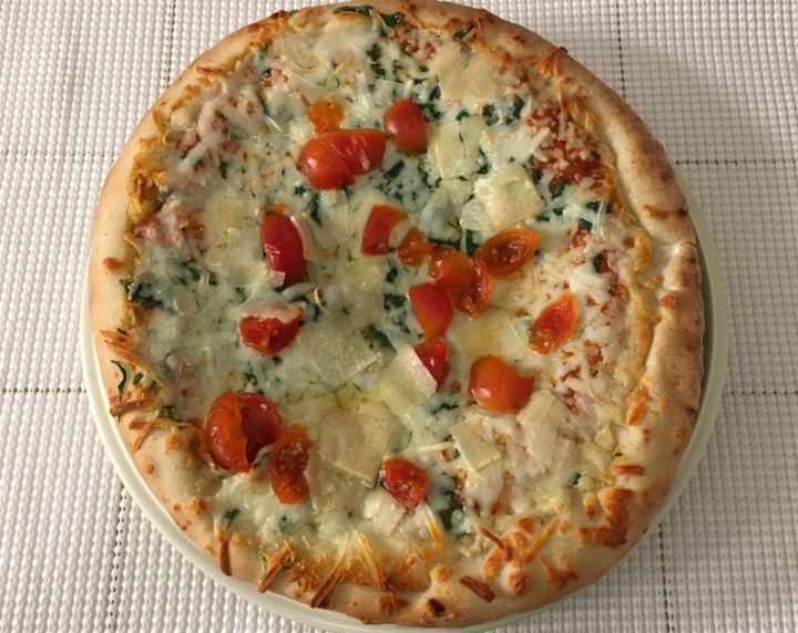 Trader Giotto's Arugula Pizza with Cherry Tomatoes, Mozzarella, Manchego, Provolone & Pecorino Cheese